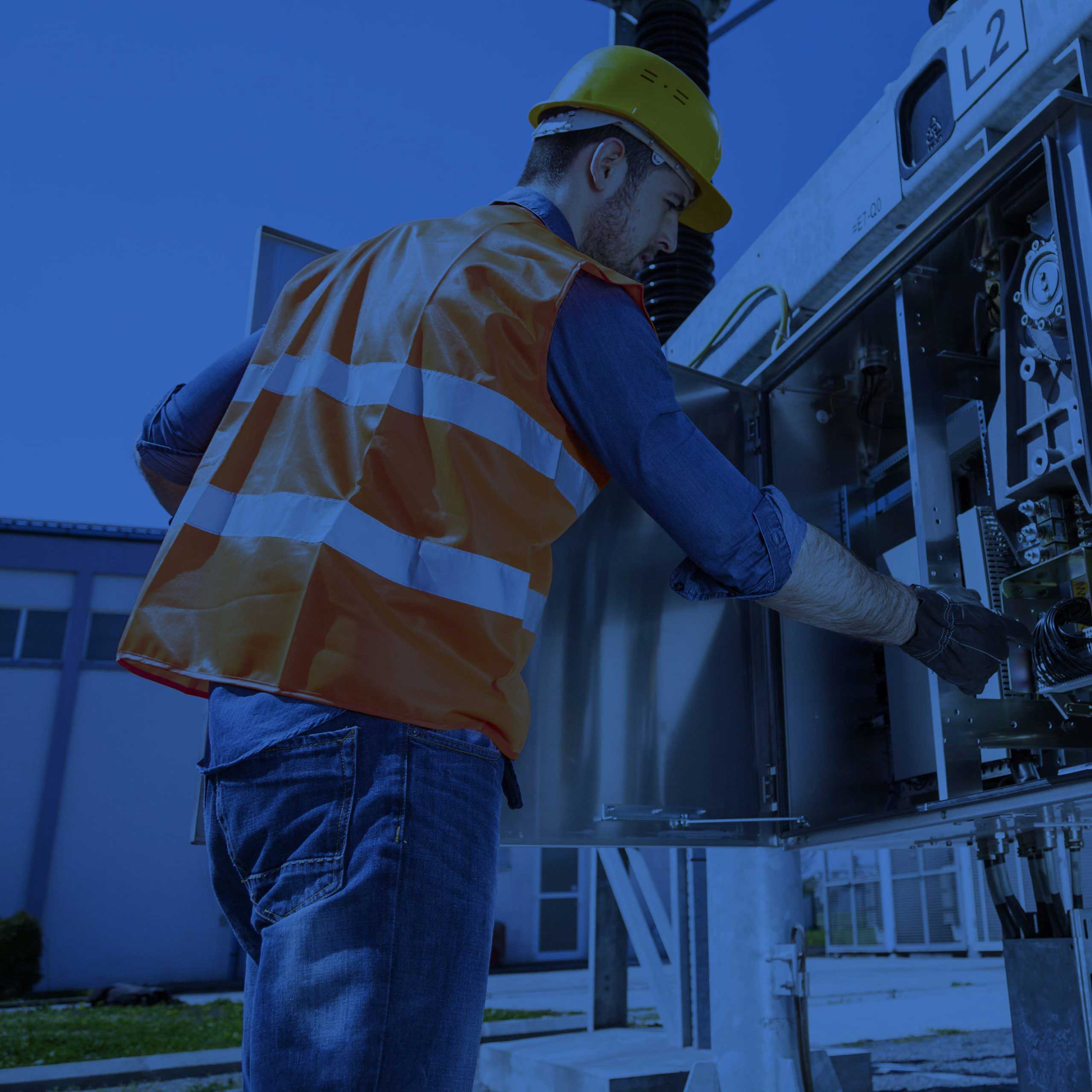 An engineer looking at a switch